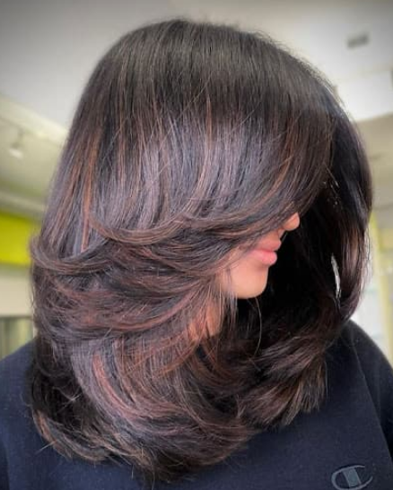Medium-Length Butterfly Cut with Highlights